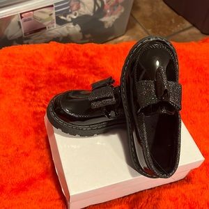 Black Patent shoes with a sparkling bow. Size 12 no tags. Brand new